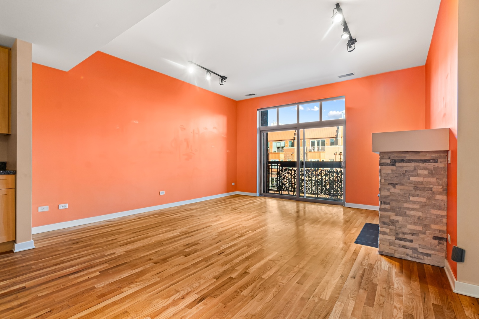 1910 South State Street, Unit 305 Chicago, IL 60616 - Photo 6 of 20 a view of an empty room with wooden floor and a window
