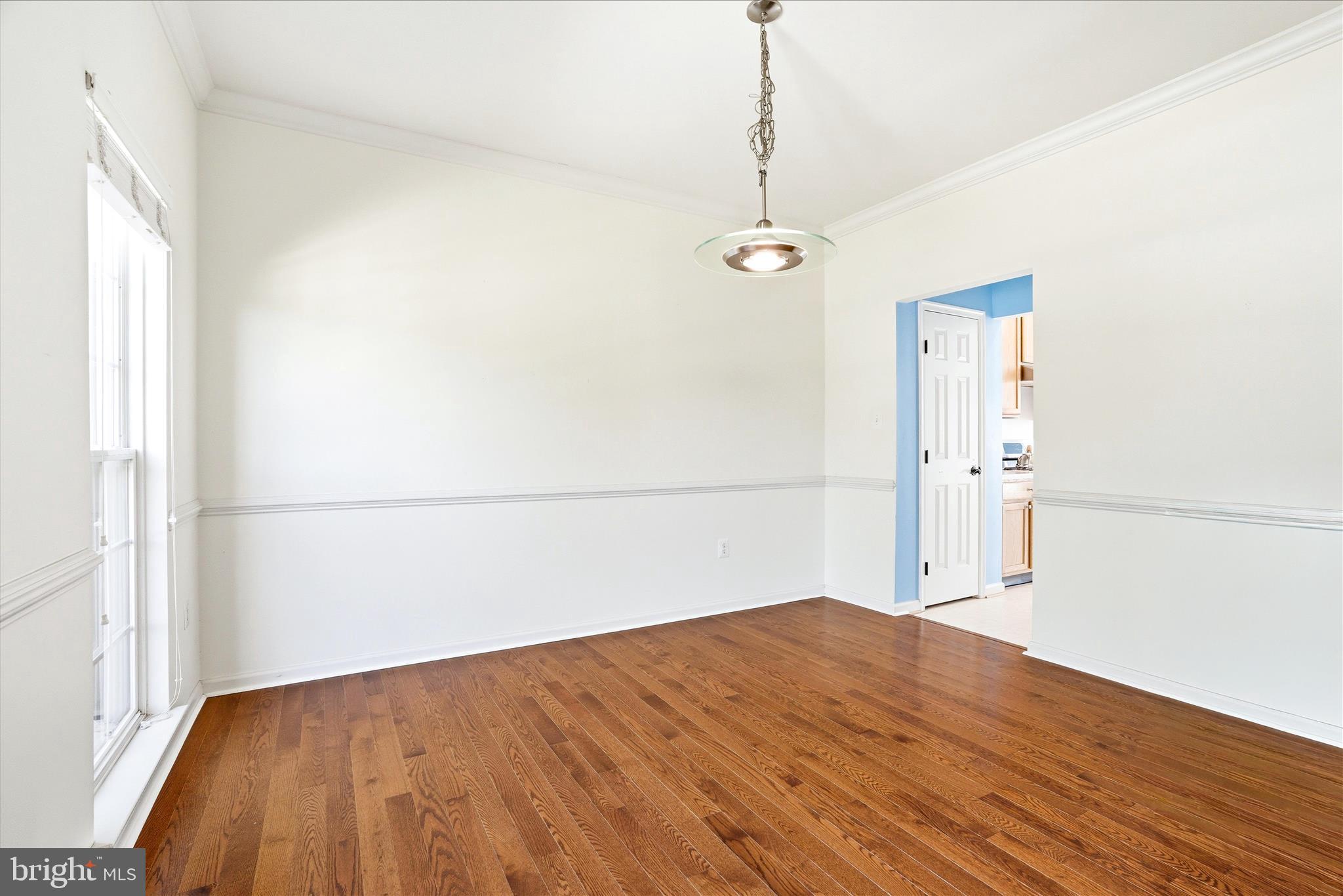 9009 Bealls Farm Road Frederick, MD 21704 - Photo 13 of 41 a view of empty room with wooden floor and fan