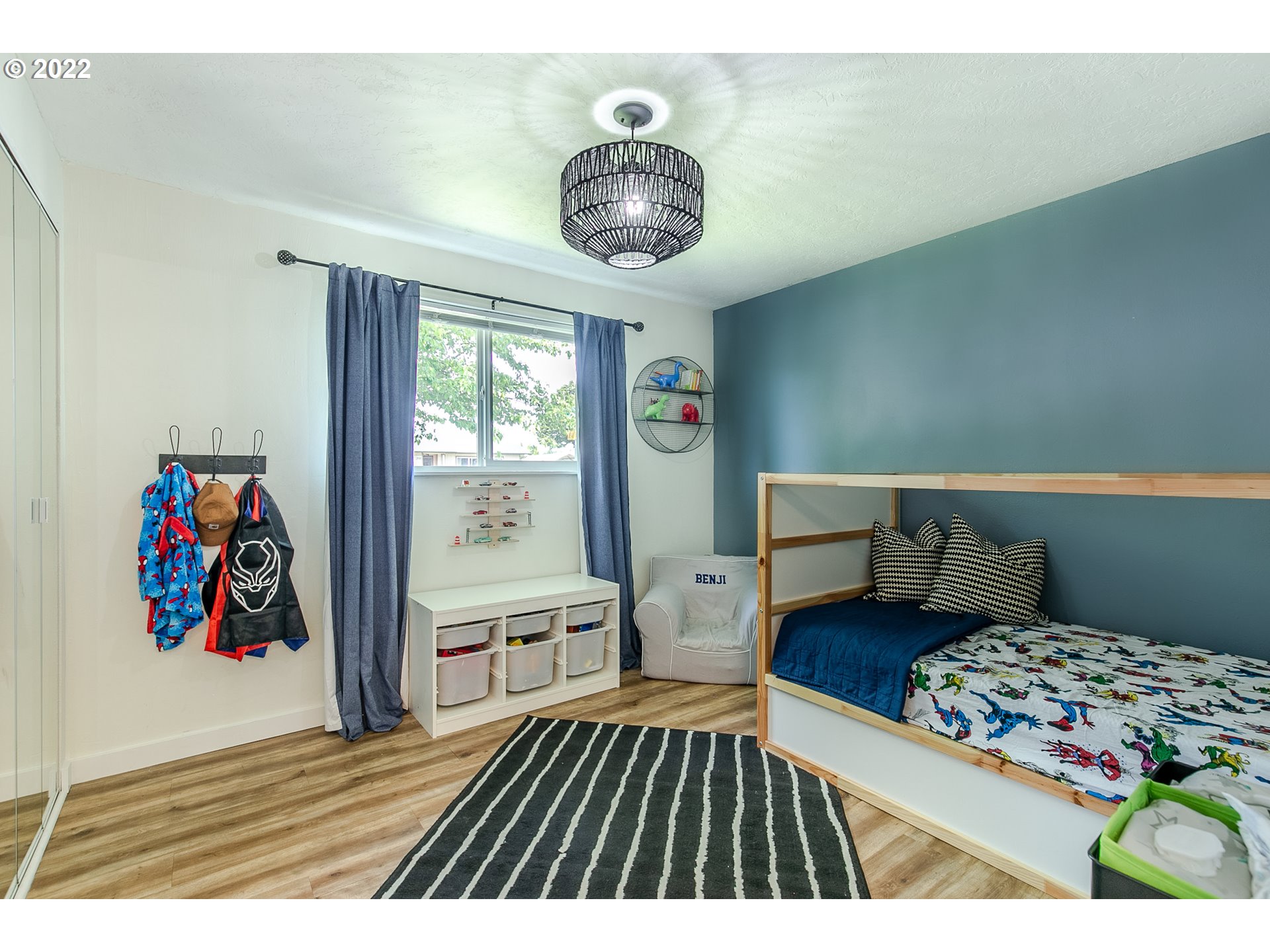 2529 27th Street Springfield, OR 97477 - Photo 12 of 20 a bedroom with a bed and a chandelier