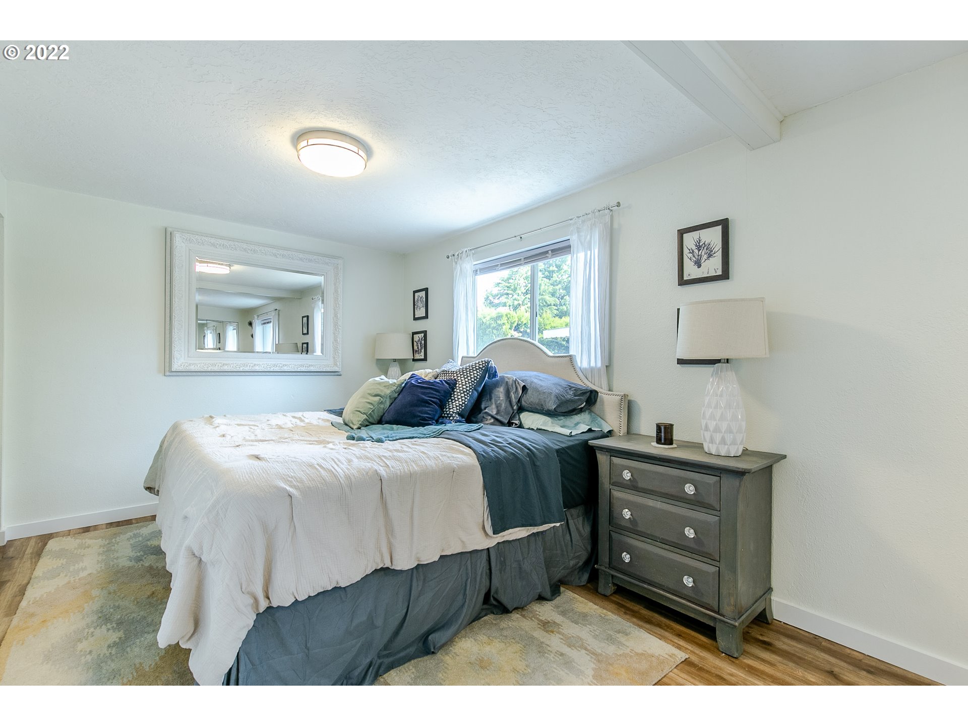 2529 27th Street Springfield, OR 97477 - Photo 13 of 20 a bed room with a bed window and wall painting
