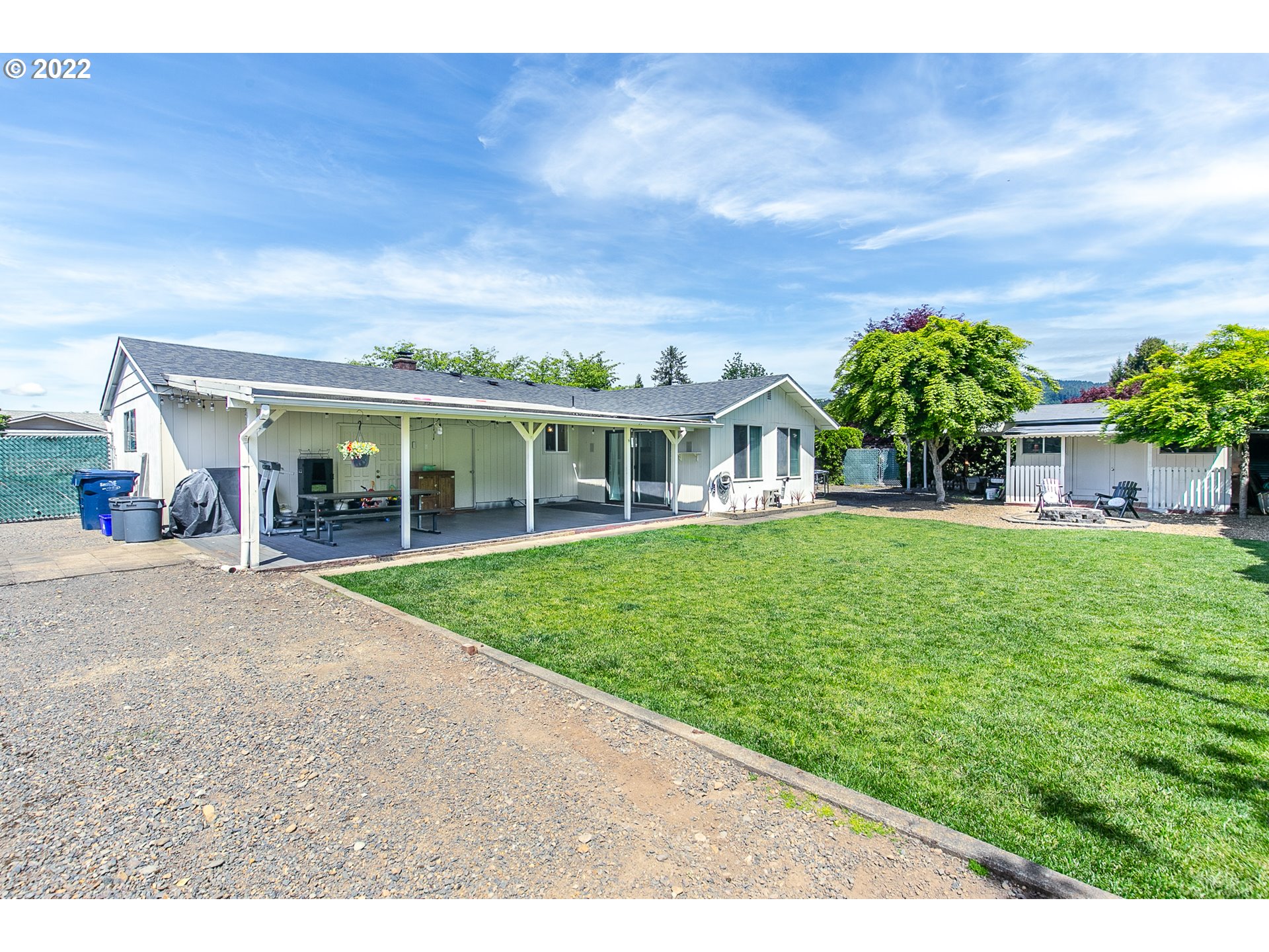 2529 27th Street Springfield, OR 97477 - Photo 18 of 20 a view of a white house with a big yard and potted plants