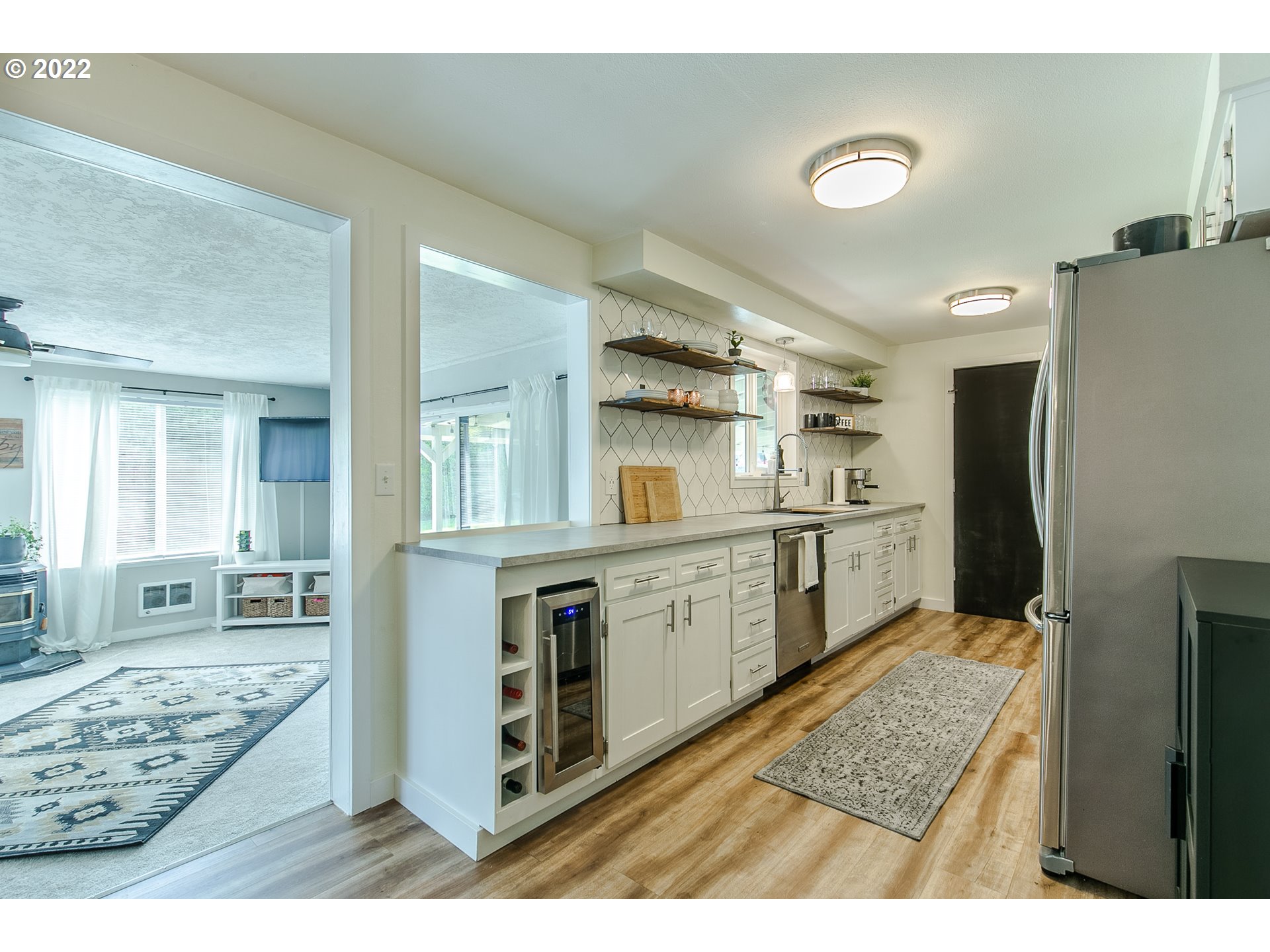 2529 27th Street Springfield, OR 97477 - Photo 6 of 20 a large white kitchen with cabinets