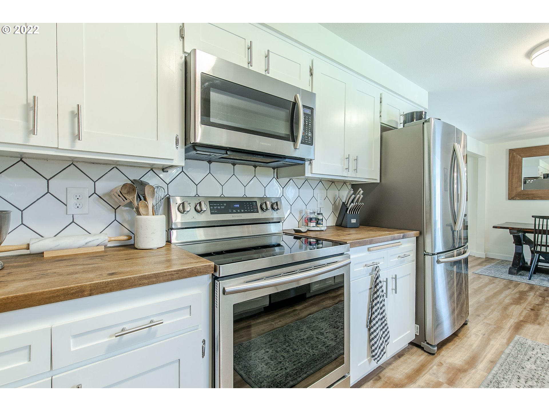 2529 27th Street Springfield, OR 97477 - Photo 8 of 20 a kitchen with stainless steel appliances granite countertop a sink stove and refrigerator