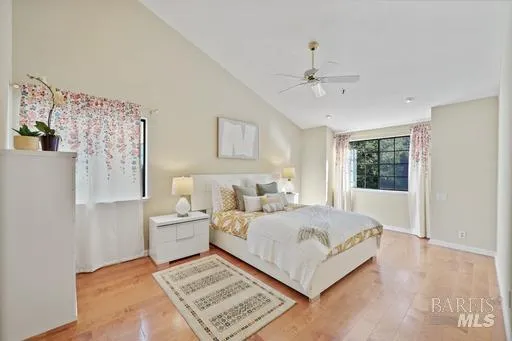 a bedroom with a large bed and a window