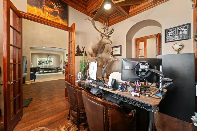 a dining room with furniture and wooden floor