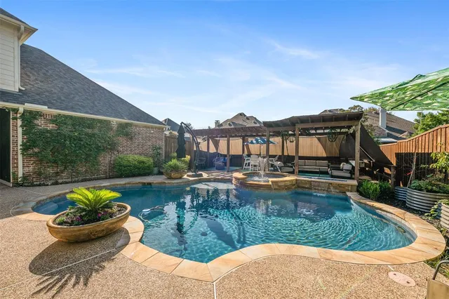 a view of a swimming pool with a patio