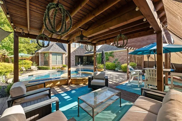 a outdoor living space with patio furniture and a fireplace