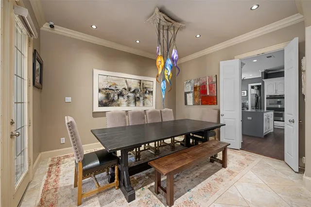 a living room with a table and chairs