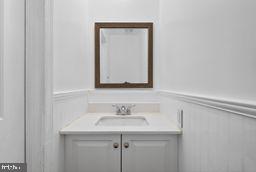 6476 Franconia Court Springfield, VA 22150 - Photo 14 of 41 a bathroom with a sink and a mirror