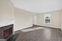 6476 Franconia Court Springfield, VA 22150 - Photo 2 of 41 a view of an empty room with wooden floor and a window