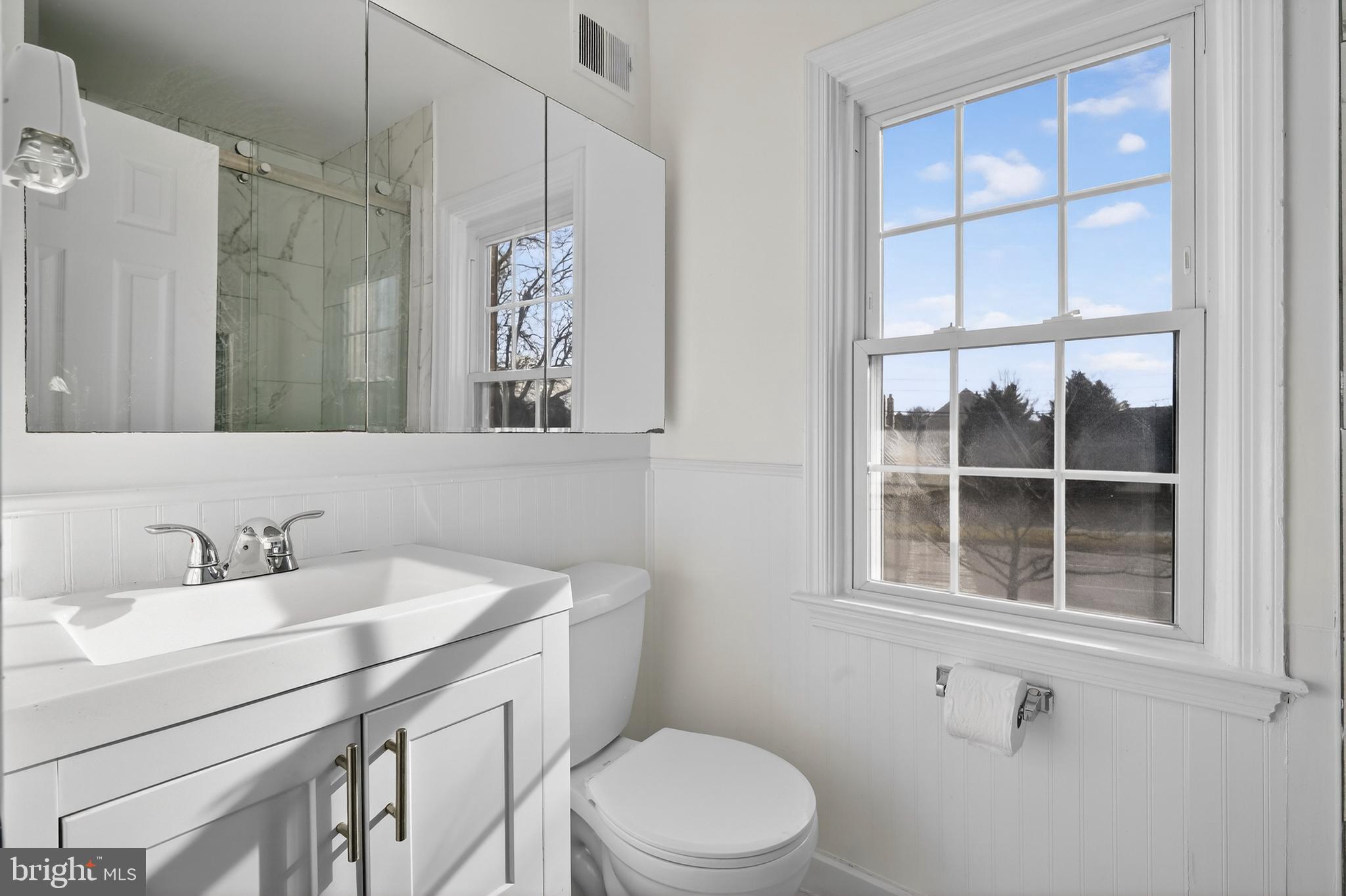 6476 Franconia Court Springfield, VA 22150 - Photo 21 of 41 a bathroom with a sink a toilet and shower
