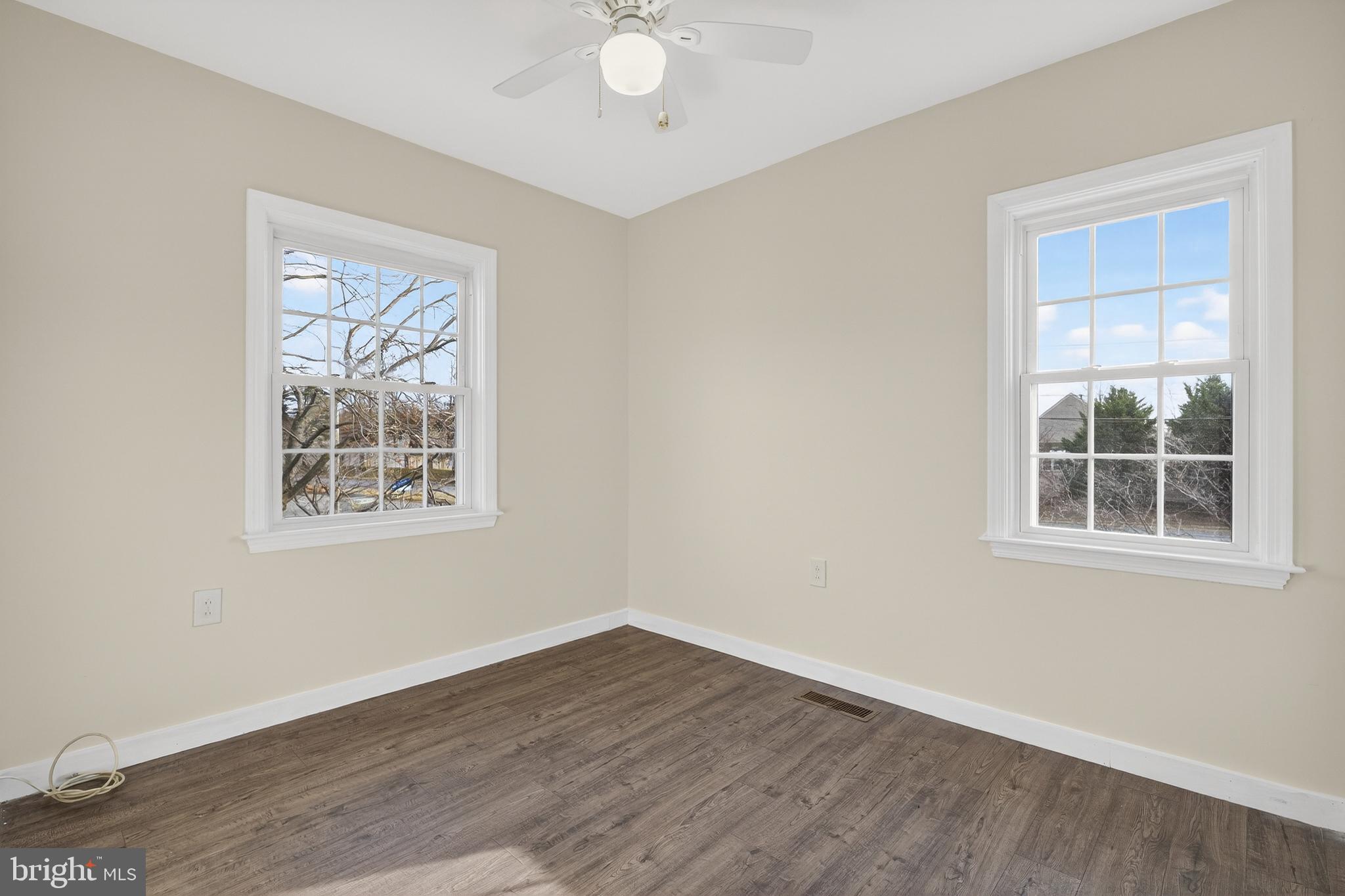 6476 Franconia Court Springfield, VA 22150 - Photo 28 of 41 an empty room with wooden floor and windows