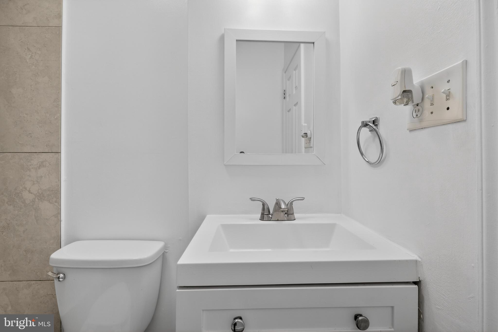 6476 Franconia Court Springfield, VA 22150 - Photo 30 of 41 a bathroom with a sink a toilet and vanity