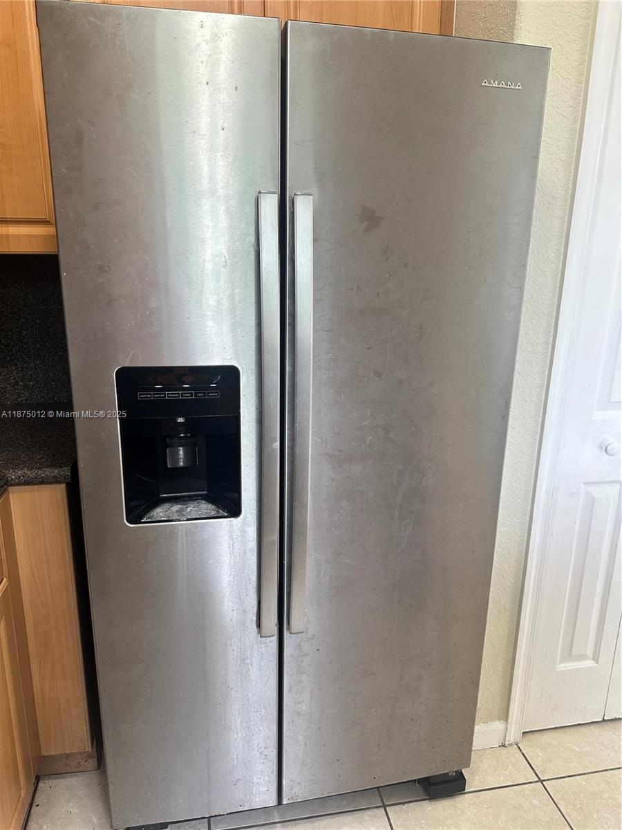 2834 Southeast 16th Avenue, Unit 111 Homestead, FL 33035 - Photo 11 of 22 a close view of a refrigerator in kitchen