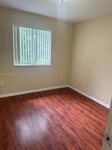 wooden floor in a hallway with wooden floor