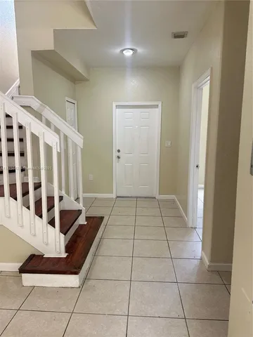 a view of a bathroom with bathtub