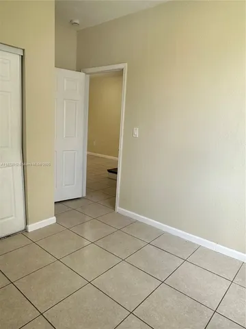 an empty room with a bathroom