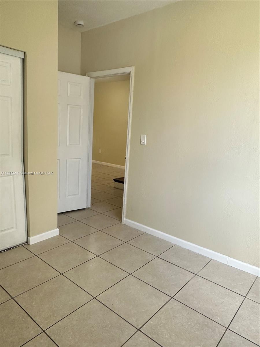 2834 Southeast 16th Avenue, Unit 111 Homestead, FL 33035 - Photo 7 of 22 an empty room with a bathroom