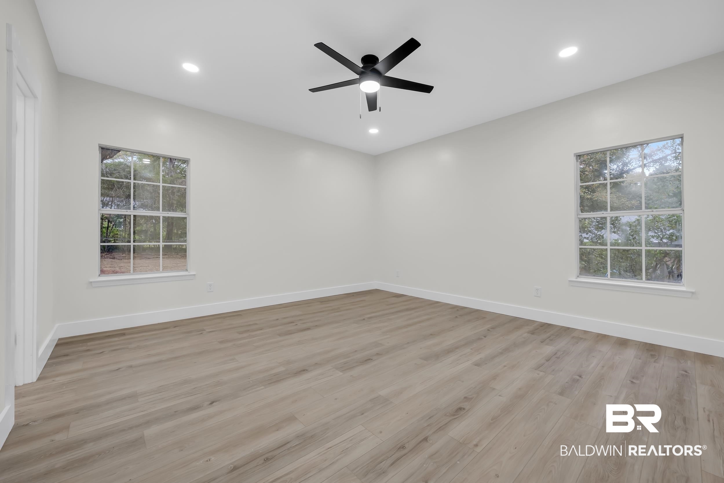 4924 Brooke Court Mobile, AL 36618 - Photo 19 of 34 Empty room featuring light wood finished floors, recessed lighting, and a ceiling fan
