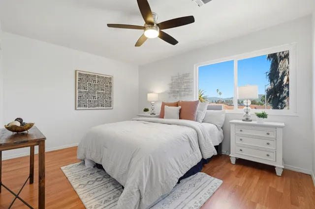 a bedroom with a bed and a dresser