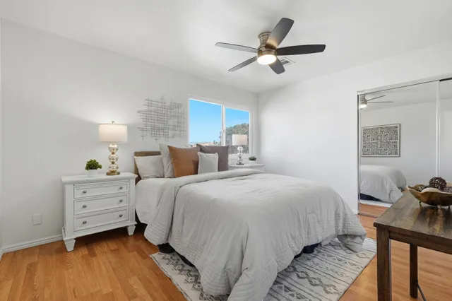 a bedroom with bed and a window