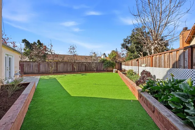 a view of a backyard with a garden