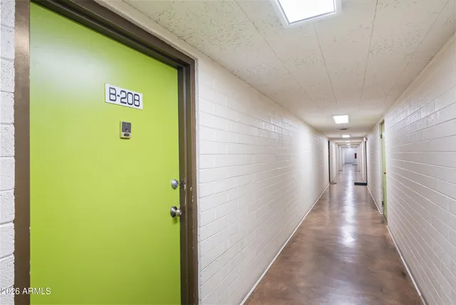 a close up of a kitchen with a sink and a wooden floor