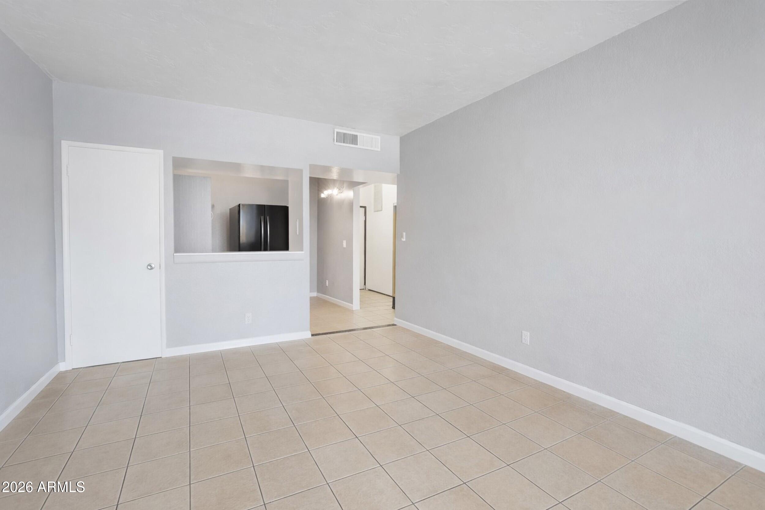 355 East Thomas Road, Unit B208 Phoenix, AZ 85004 - Photo 5 of 22 a view of a big room with wooden floor and fireplace