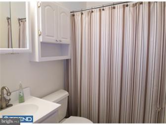 8 June Road Levittown, PA 19056 - Photo 8 of 12 a bathroom with a toilet a sink and curtain