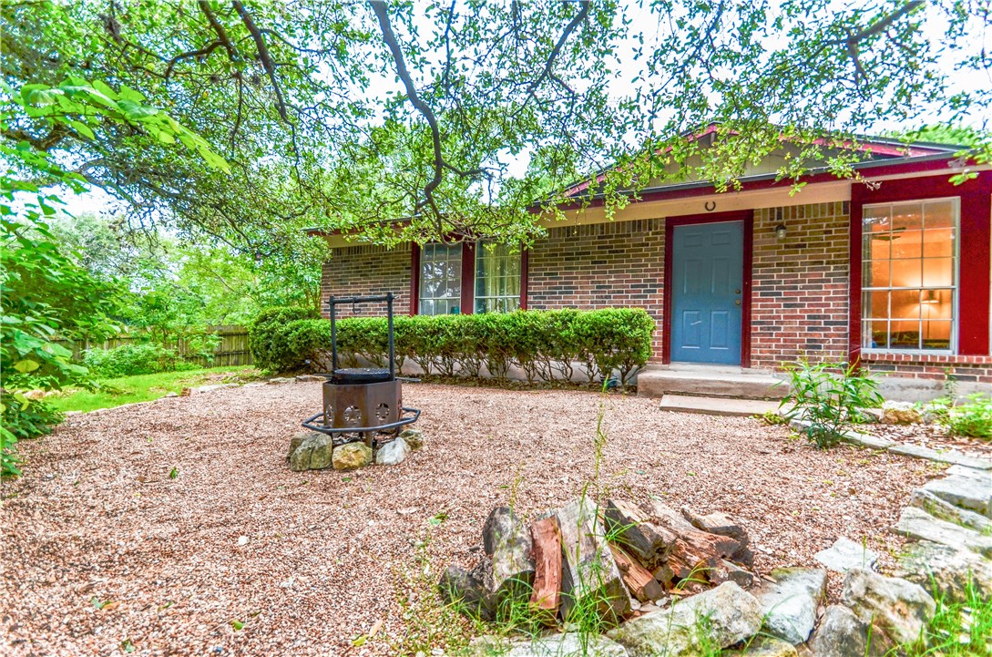 8202 Longview Road Austin, TX 78745 - Photo 1 of 1 a front view of a house with garden