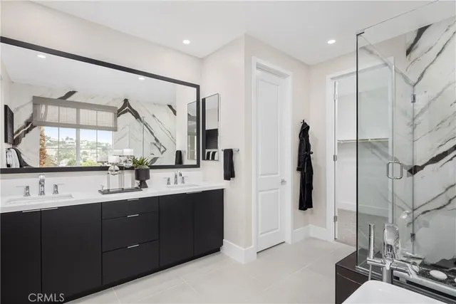 a bathroom with a double vanity sink and mirror