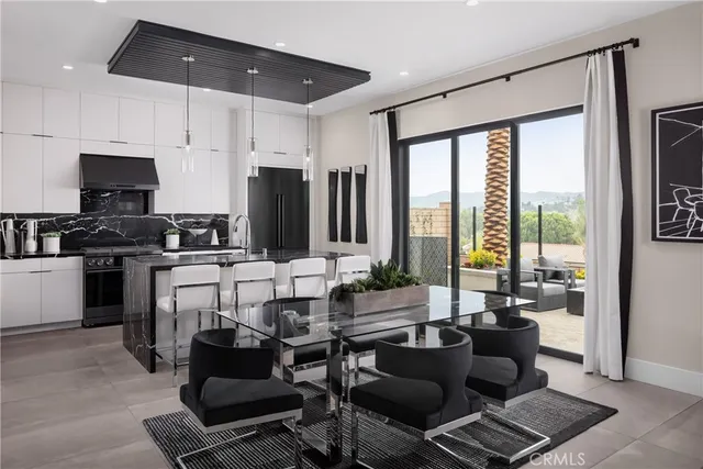 a living room with furniture a flat screen tv and a large window