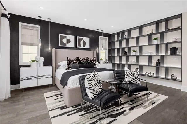 a bedroom with furniture and a book shelf