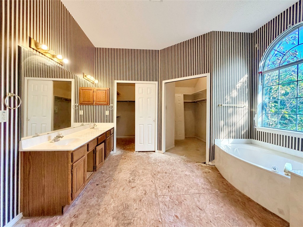 1106 Thistle Trail Cedar Park, TX 78613 - Photo 14 of 37 a bathroom with a tub sink shower and mirror
