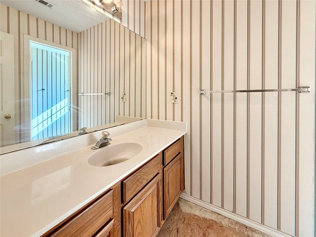 1106 Thistle Trail Cedar Park, TX 78613 - Photo 19 of 37 a bathroom with a sink and a large mirror