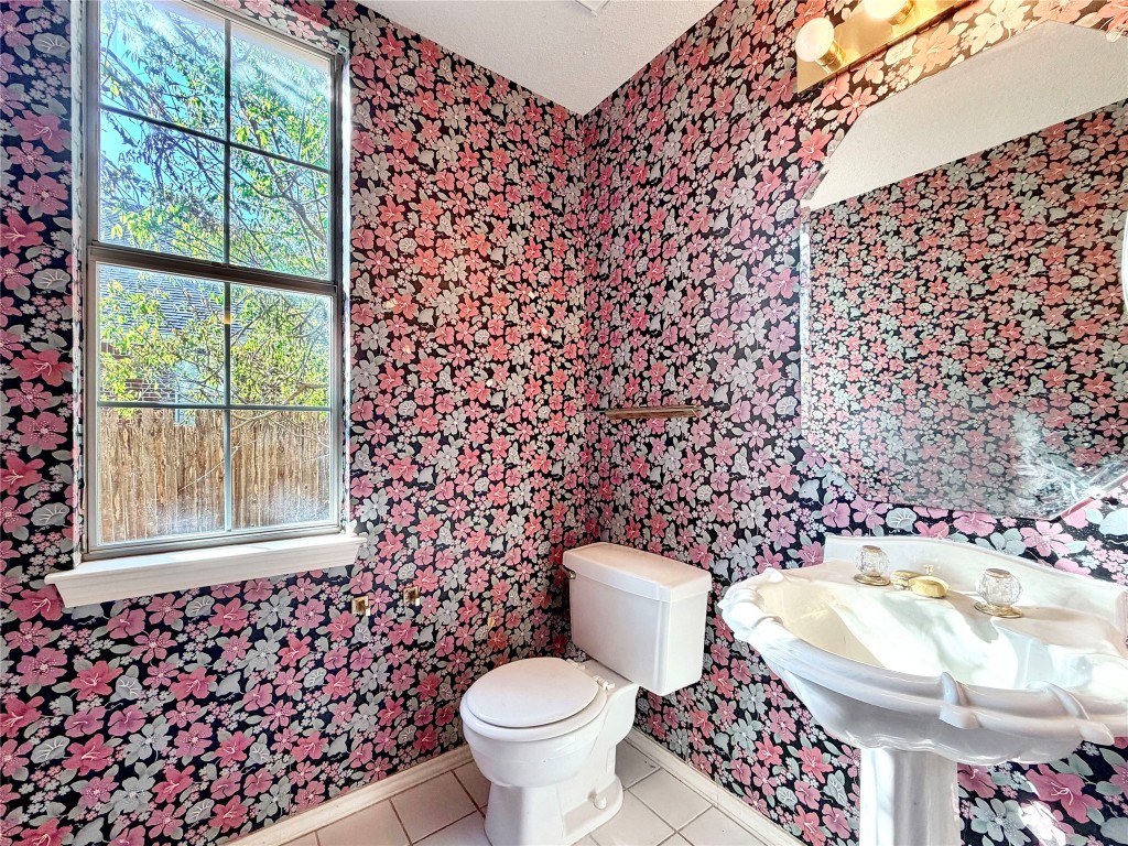 1106 Thistle Trail Cedar Park, TX 78613 - Photo 21 of 37 a bathroom with a toilet and a sink