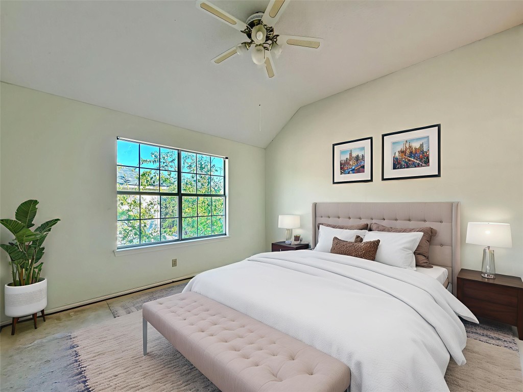 1106 Thistle Trail Cedar Park, TX 78613 - Photo 3 of 37 a bedroom with a large bed and a chandelier