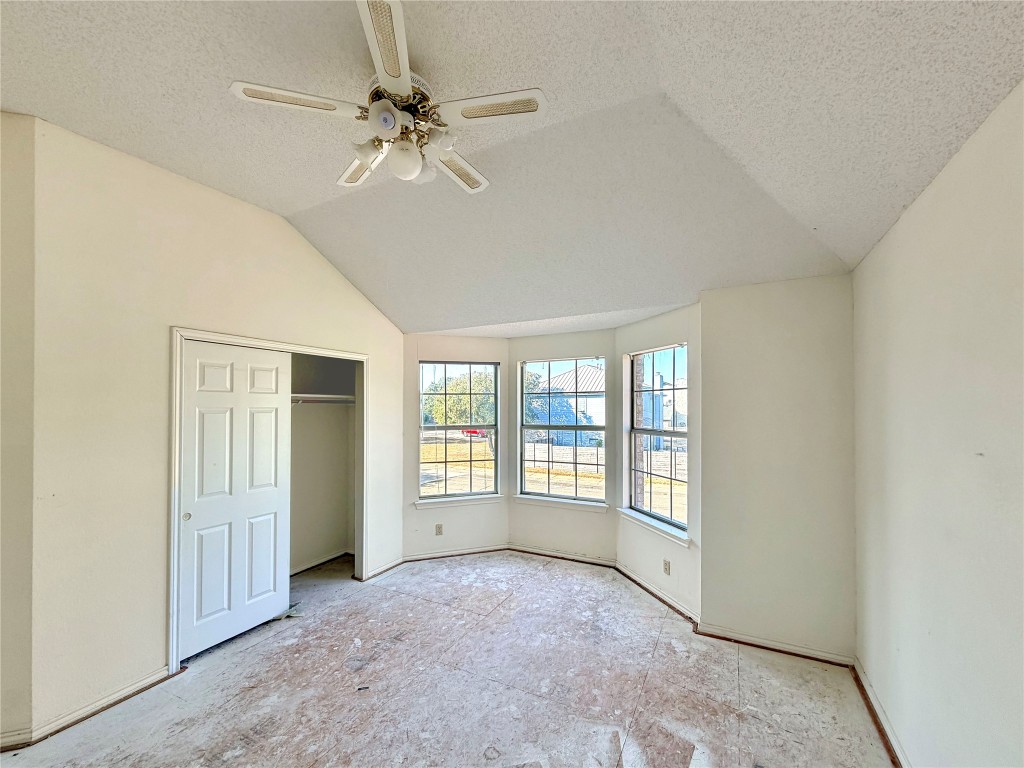 1106 Thistle Trail Cedar Park, TX 78613 - Photo 31 of 37 an empty room with chandelier fan and windows