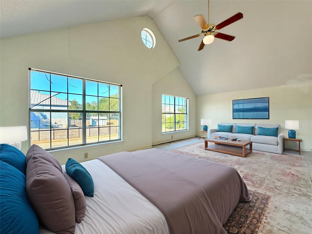 1106 Thistle Trail Cedar Park, TX 78613 - Photo 4 of 37 a spacious bedroom with a bed a couch and a window