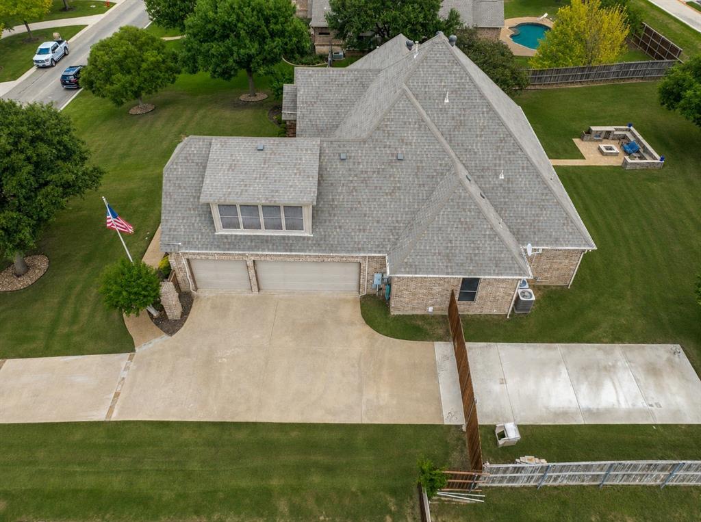 229 Arbor Lane Haslet, TX 76052 - Photo 29 of 34 Brick exterior residence with a multi-gabled roof and a two-car garage