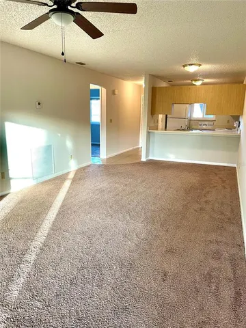 a view of a kitchen with a sink
