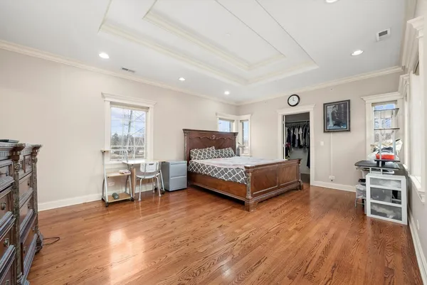 a bed room with a bed and a chair