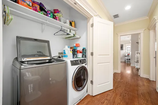 a view of a storage and utility room with washer and dryer