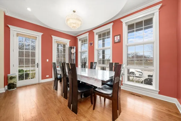 a dining room with furniture window wooden floor