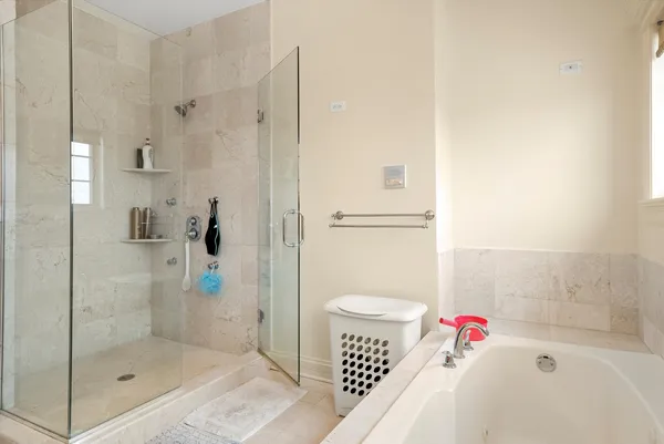 a bathroom with a shower and a toilet