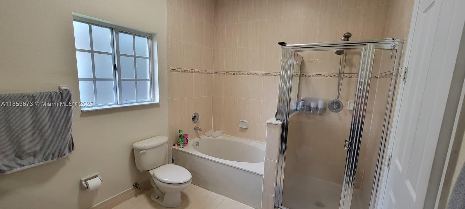 13281 Southwest 206th Terrace Miami, FL 33177 - Photo 11 of 18 a bathroom with a granite countertop sink toilet and shower