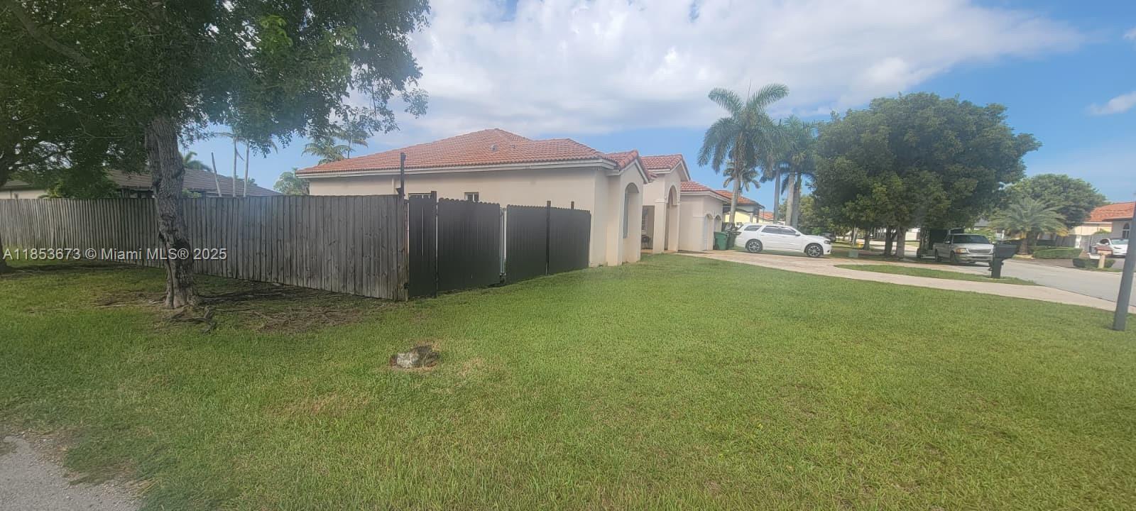 13281 Southwest 206th Terrace Miami, FL 33177 - Photo 18 of 18 a view of a garden with a small barn