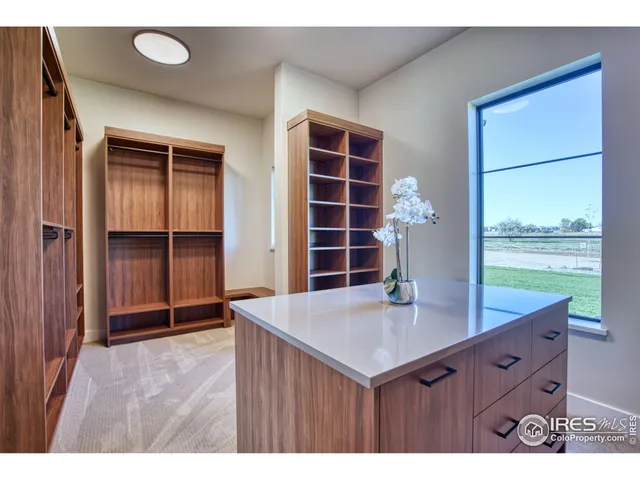 a view of kitchen with a sink and a large window