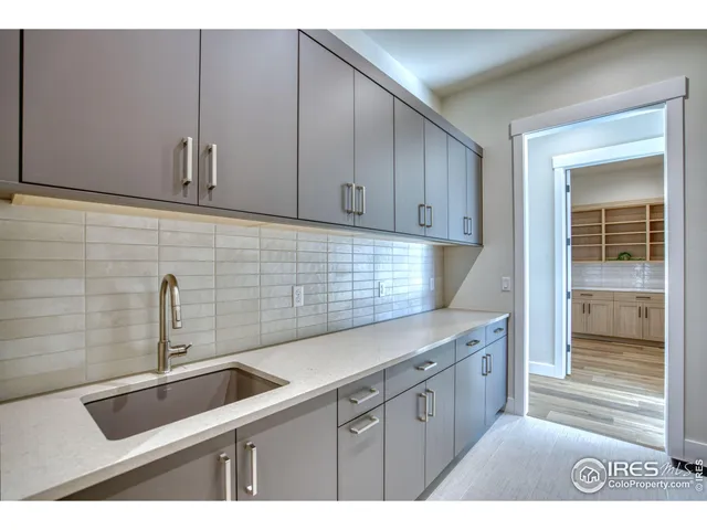 a room with cabinets and wooden floor