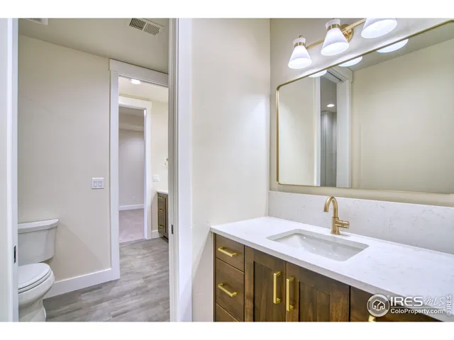a bathroom with a sink and vanity